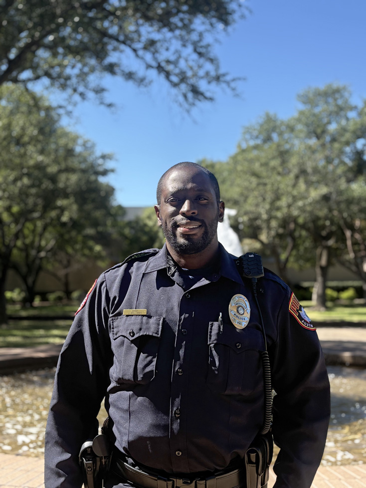 Jakim in uniform (cop) in front of fountain