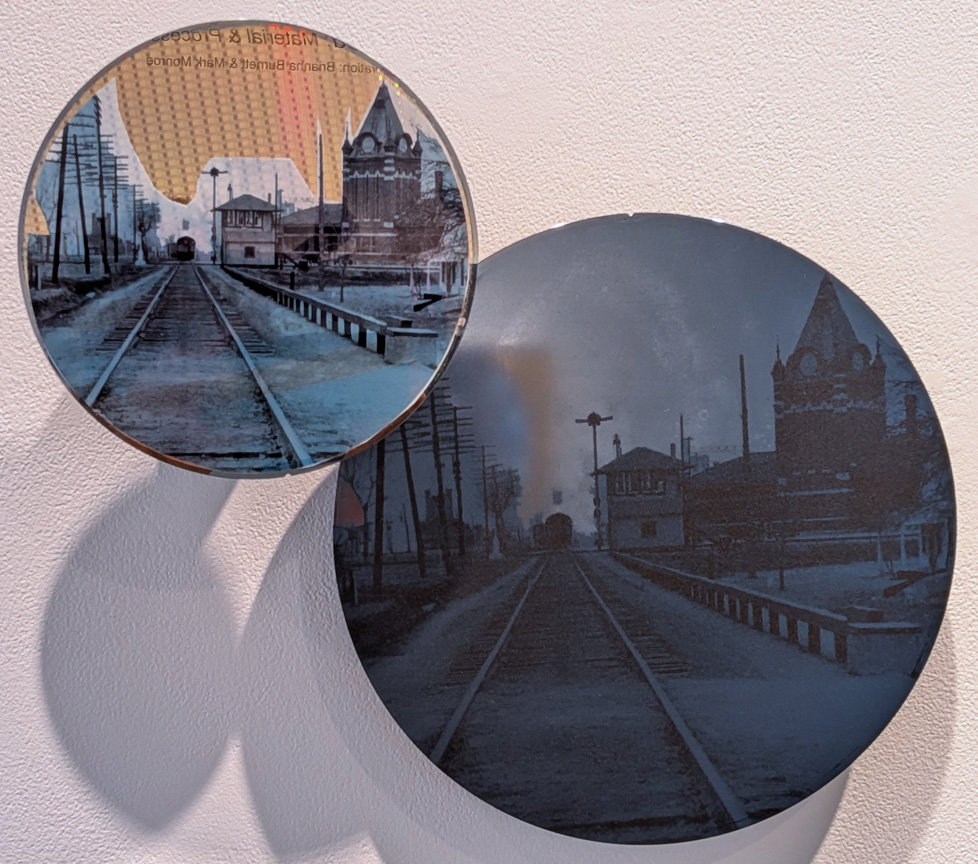 detail of 2 discs with historic city photos