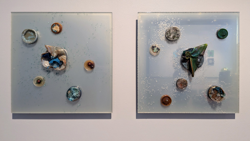 2 squares of acrylic with circular protrusions